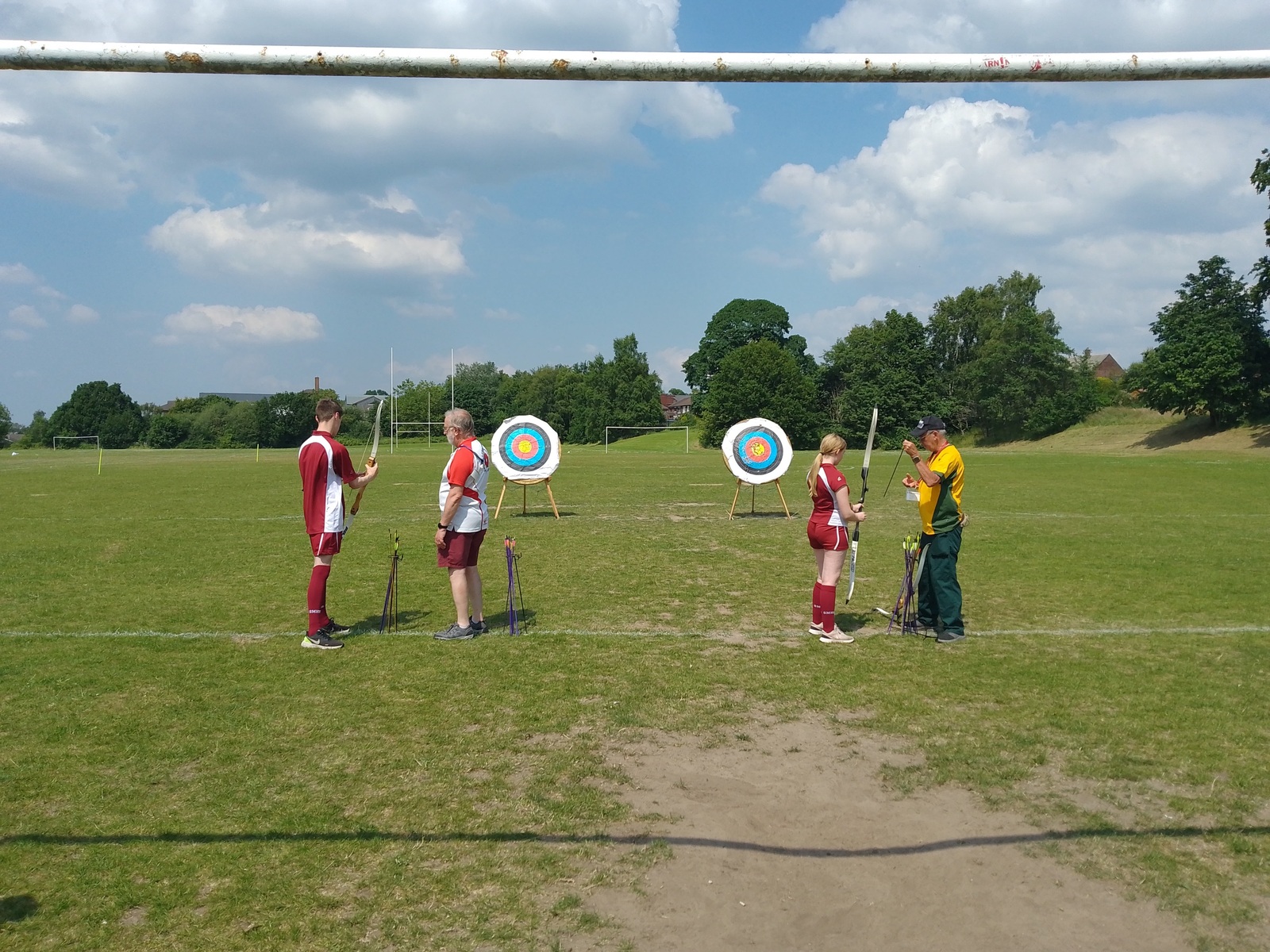 Students trying archery during a PE lesson